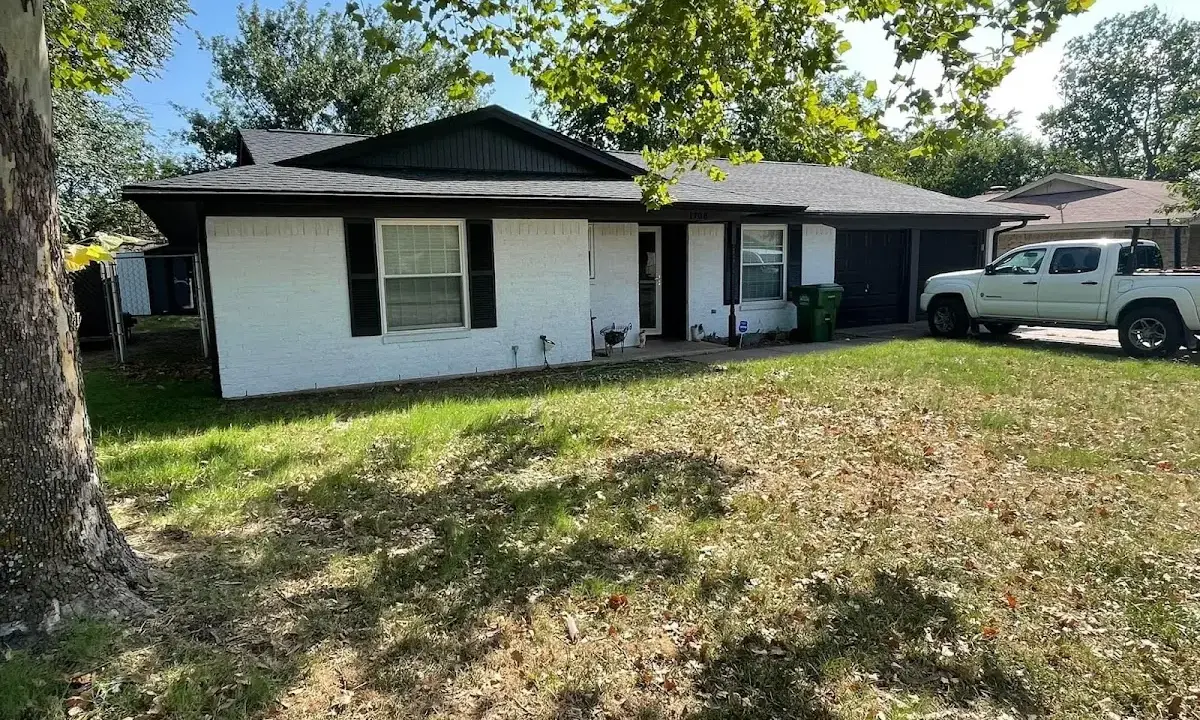 Professional roofing crew working on a residential roof in Winter Garden
